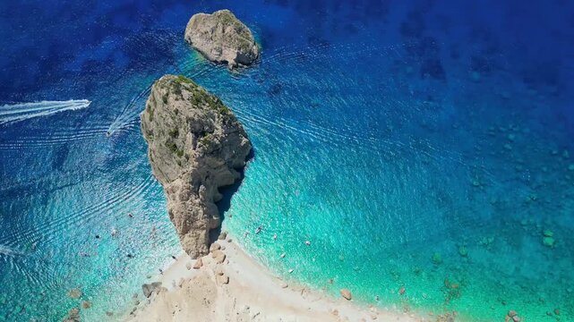 Spectacular view of Mizithres sea stacks and white limestone cliffs in Zakynthos. Crystal turquoise water and dramatic coastline of the Ionian Sea in a scenic Greek island landscape.