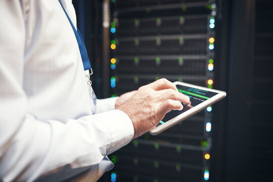 Hands, engineer or code on tablet screen in server room for CPU usage, track assets or IT support. Technician, man and typing on tech in data center for system backup, network review or monitor power