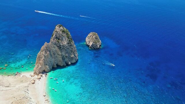 Spectacular view of Mizithres sea stacks and white limestone cliffs in Zakynthos. Crystal turquoise water and dramatic coastline of the Ionian Sea in a scenic Greek island landscape.