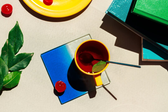 Vibrant geometric still life with tea cup and sharp shadows