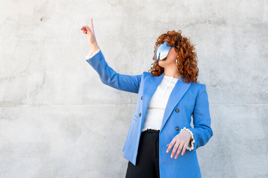 Entrepreneur interacting with virtual reality outdoors in Granada
