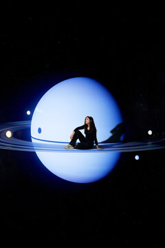 3D woman blue planet on a luminous ring in deep space