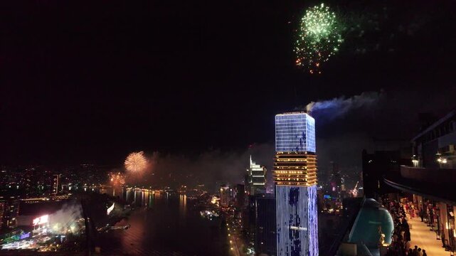 Ho Chi Minh City ,Vietnam 1st Jan, 2026 epic 4k video during night time of Saigon River skyline look from roof top of Sea Tower - fire work for new year eve