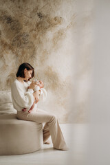Obraz premium feeding a baby, mother feeding a baby from a bottle, baby food concept, formula milk