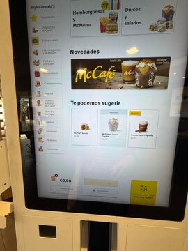Palma, spain, may 2, 2026, mcdonald's self service kiosk offering digital menu selection for fast food and mccafe items, showing user interface