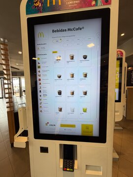 Palma, spain, may 2, 2026, mcdonald's mccafe digital kiosk showing beverage menu items for self service ordering and payment system