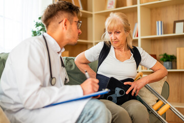 Obraz premium A senior woman in rehabilitation is assisted by a medical professional, highlighting care, recovery, and physical therapy support.