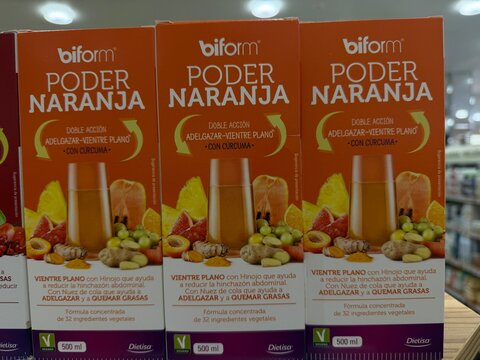Palma, spain, may 2, 2026, bifom poder naranja dietary supplement boxes for weight loss and flat stomach, containing turmeric and fruit ingredients