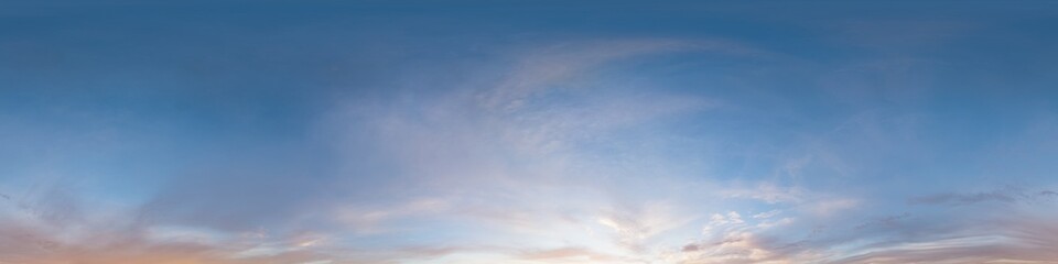 Fototapeta premium Sky panorama clouds over a wide equirectangular view showing soft colorful wisps during sunset or dawn