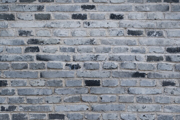 Gray brick wall texture forming rustic background © zhikun sun