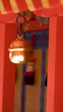 Traditional Brass Suzu Bells Hanging at a Shinto Shrine in Kyoto