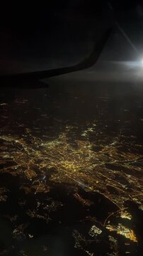 A view from an airplane flying over Milan, Italy, at night