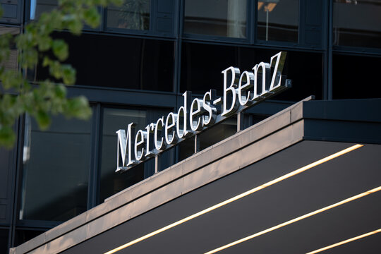 Mercedes-Benz Group AG logo sign on the company office building. German luxury automotive corporation headquarters branch with brand logotype on April 21, 2026 in Berlin, Germany.