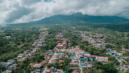 Aerial Overview of Majayjay Town Laguna, Rural Philippines Cityscape with Mount Banahaw Peak under Cloudy Sky, Provincial Landscape and Residential District © Gids Stories