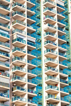Vibrant balcony geometry and abstract pattern on urban apartment building facade architecture in spain showing modern residential exterior detail