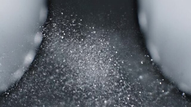 Salt Being Sprinkled Between Fingers Closeup.