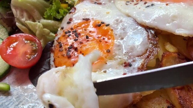 Fried potatoes with fried eggs breakfast