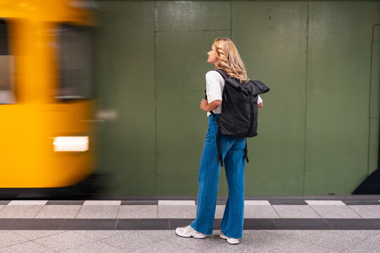 Woman waiting for subway train at Berlin underground station