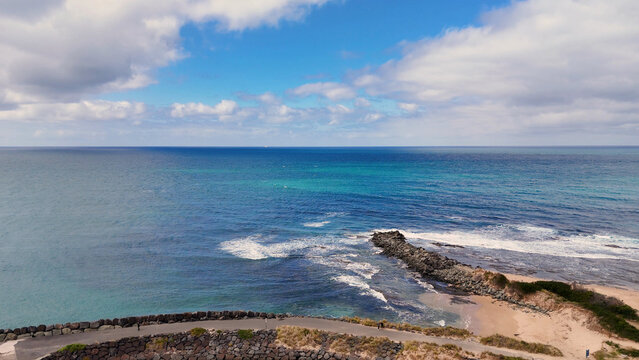Aerial View of the Scenic Coastline and Rock Jetty in Lorne