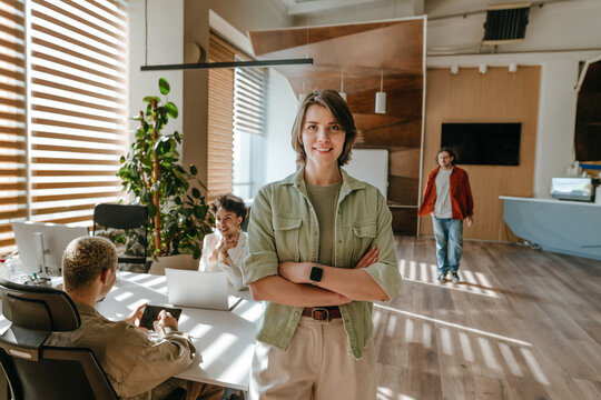 Smiling businesswoman standing in a modern office