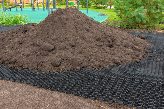 Geocell installation enabling fire truck access through reinforced lawn while maintaining green surface for safety compliance
