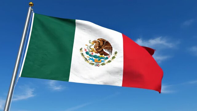 Mexican flag waving on flagpole against clear blue sky