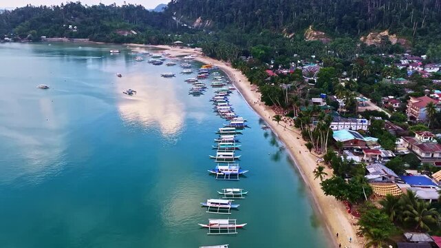 Port Barton Beach, Palawan, Philippines showing a tropical coastline and boats