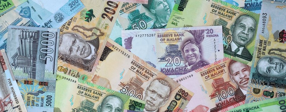 Malawian kwacha money banknotes bunch on table. Malawi bills of MWK currency