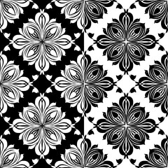 Fototapeta premium Flower pattern seamless design with ornate white floral rosettes and symmetrical black background texture