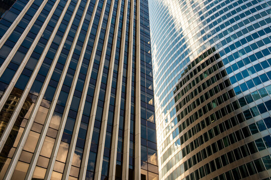 Looking upward in paris la defense the architecture skyscraper turns glass perspective lines and pattern into abstract geometry with corporate clarity