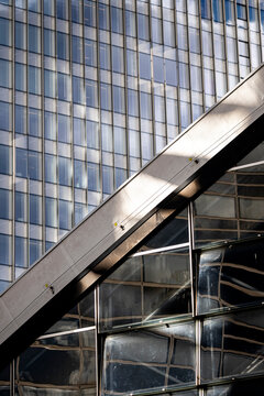Seen up close in paris la defense the architecture detail combines glass steel lines and pattern into abstract geometry with graphic appeal
