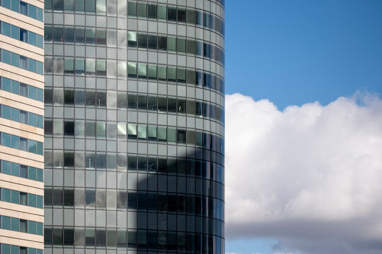 Rising above paris la defense the architecture skyscraper office reveals glass curves and pattern as abstract geometry in a polished urban view