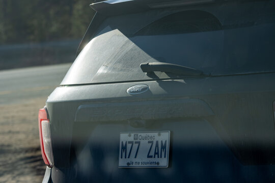 Quebec, Canada, 24 April 2026 : The rear of a dirty Ford Explorer SUV displays a Quebec license plate.