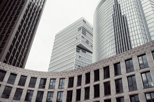 Skyscrapers and towers over the city create perspective lines and geometry forming modern architecture as an abstract background for layouts