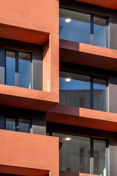 Orange facade with balconies and blocks highlights modern architecture geometry and pattern delivering an abstract background for clean layouts