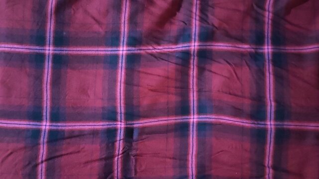 Red plaid fabric texture, wrinkled check pattern textile background
