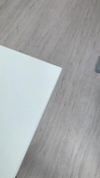 A woman's hand removes the soft silicone corner. Corner guard, protecting the kid from injury, protects bumping child's head Parents care for the baby