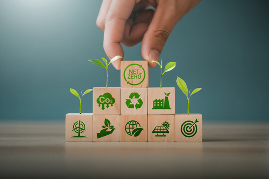 The concept of carbon neutrality and net-zero greenhouse gas emissions; the natural environment; long-term strategies for climate neutrality; greenhouse gas emission targets; wooden block icon.