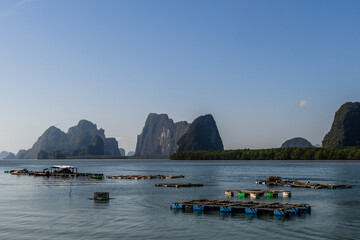 Fish farms on Phang Nga Bay, Thailand, on the shores of  Ko Panyi, also known as Koh Panyee, a Muslim, floating, fishing village, notable for being built on stilts by Bugis fishermen. © Yehoshua Halevi