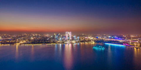 Obraz premium Aerial shot of the night skyline of Jinji Lake in Suzhou, Jiangsu Province, China