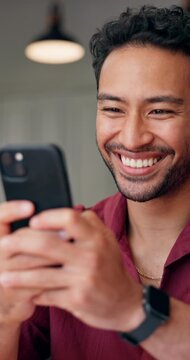 Man, typing and laugh in home with phone, online meme and notification for text message conversation. Happy, person and scroll in house with tech, mobile app and social media for funny entertainment.