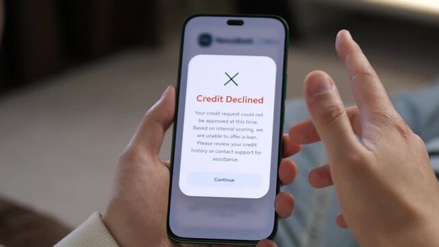 Close-up of a mobile banking app with a rejected credit request. Professional UI, UX design showcasing a financial setback. Ideal for fintech tutorials, debt counseling, and banking reviews. High