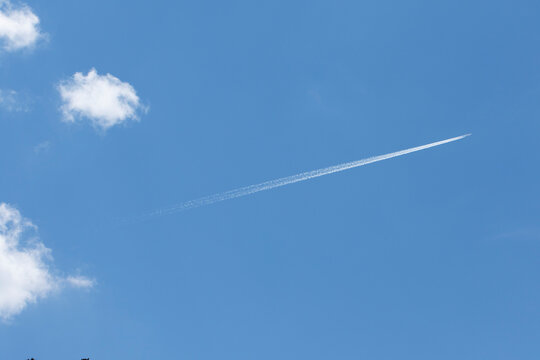 A jet aircraft flies high in the sky, powered by jet engines, often leaving a white contrail