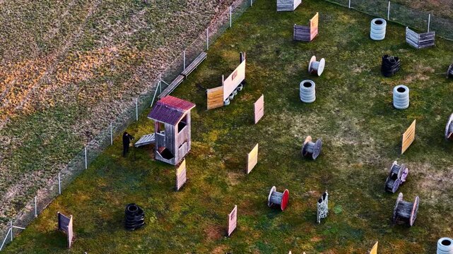 Paintball field showing game setup with bunkers and obstacles for sport activity