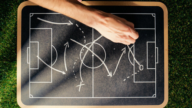 Tactical scheme of football match on blackboard