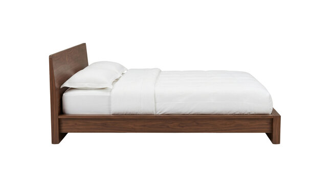 Dark walnut platform bed with white bedding side view isolated. Furniture mockup.