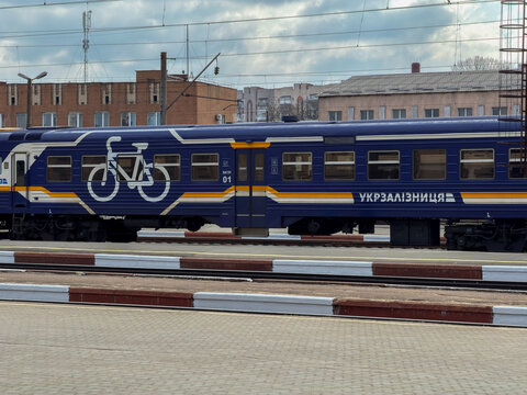 Khmelnytskyi, Ukraine - March 30, 2026: Ukrzaliznytsia train carriage with bike icon parked at the station platform for regional passenger travel and sustainable transport