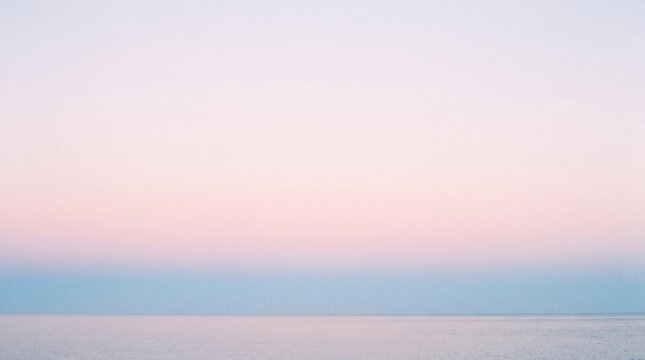 soft pastel gradient sky at sunrise with horizontal wispy clouds for serene background design
