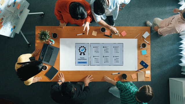 A dynamic team collaborates in a modern office setting, focusing on project completion, idea generation, and celebrating innovative achievements through visual aids. Trope