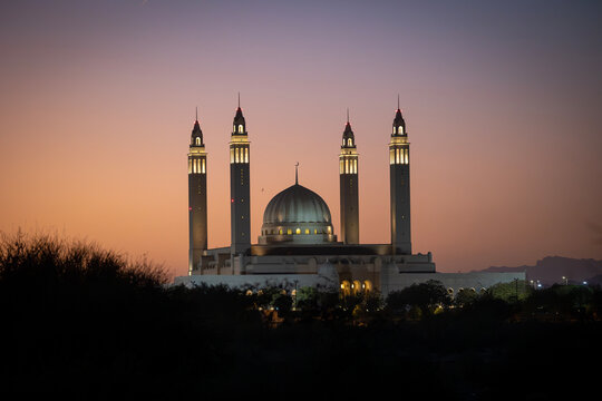 Nizwa Sultan Qaboos Mosque in Oman with sunset in the background